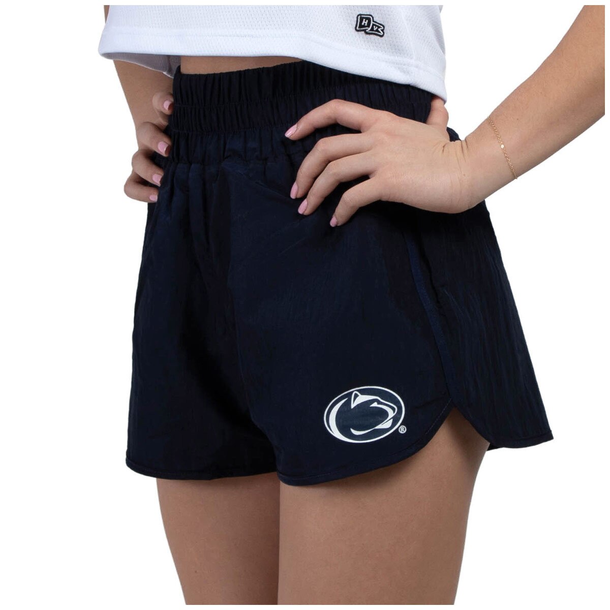 side view of model wearing women's high waisted navy shorts with Penn State Athletic Logo